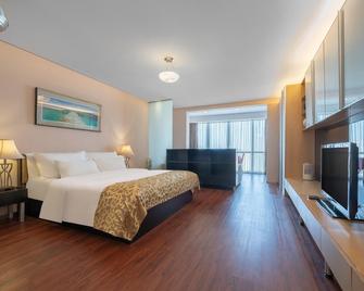 Qingdao Housing International Hotel - Qingdao - Habitación