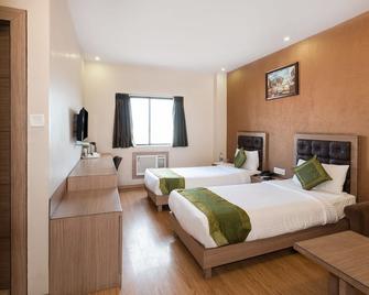 Treebo Pal Comfort - Jamshedpur - Bedroom