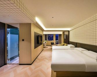 Maijian Hotel (Shenyang Convention and Exhibition Center Sports College South Station Branch) - Shenyang - Schlafzimmer