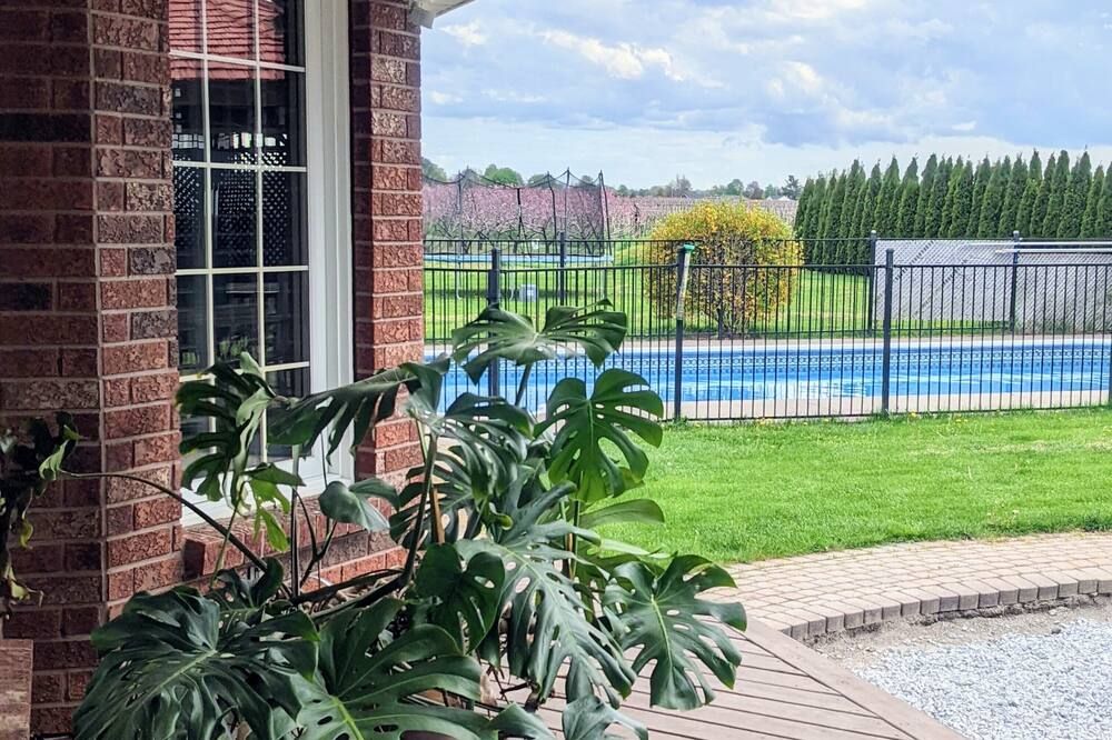 Pool view of A poolside guest suite nested in a beautiful orchard along winery route