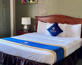 Sandals Inn - Daytona Beach - Yatak Odası