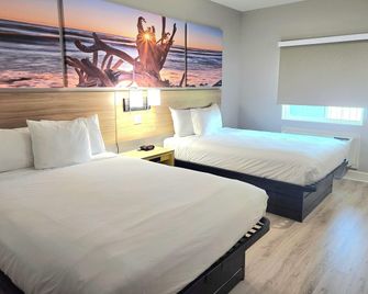 Days Inn & Suites by Wyndham Galveston West/Seawall - Galveston - Soveværelse