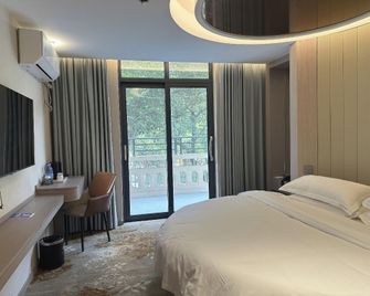 Kylia Hotel (Jingzhou Renxinhui Cultural Palace Branch) - Jingzhou - Schlafzimmer