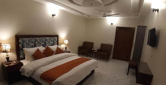 Hotel Executive Lodges - Bahāwalpur - Bedroom