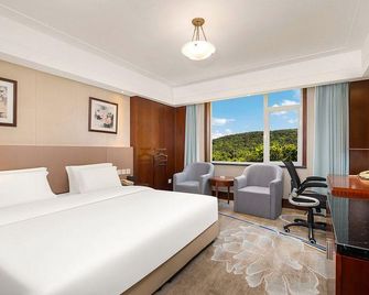 Grand Rezen Hotel Shandong Healthy Golden Bay - Weihai - Camera da letto