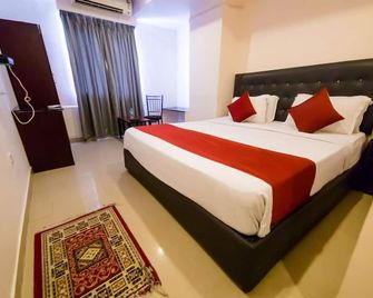 Hotel Sashi Grand - Vijayawada - Slaapkamer