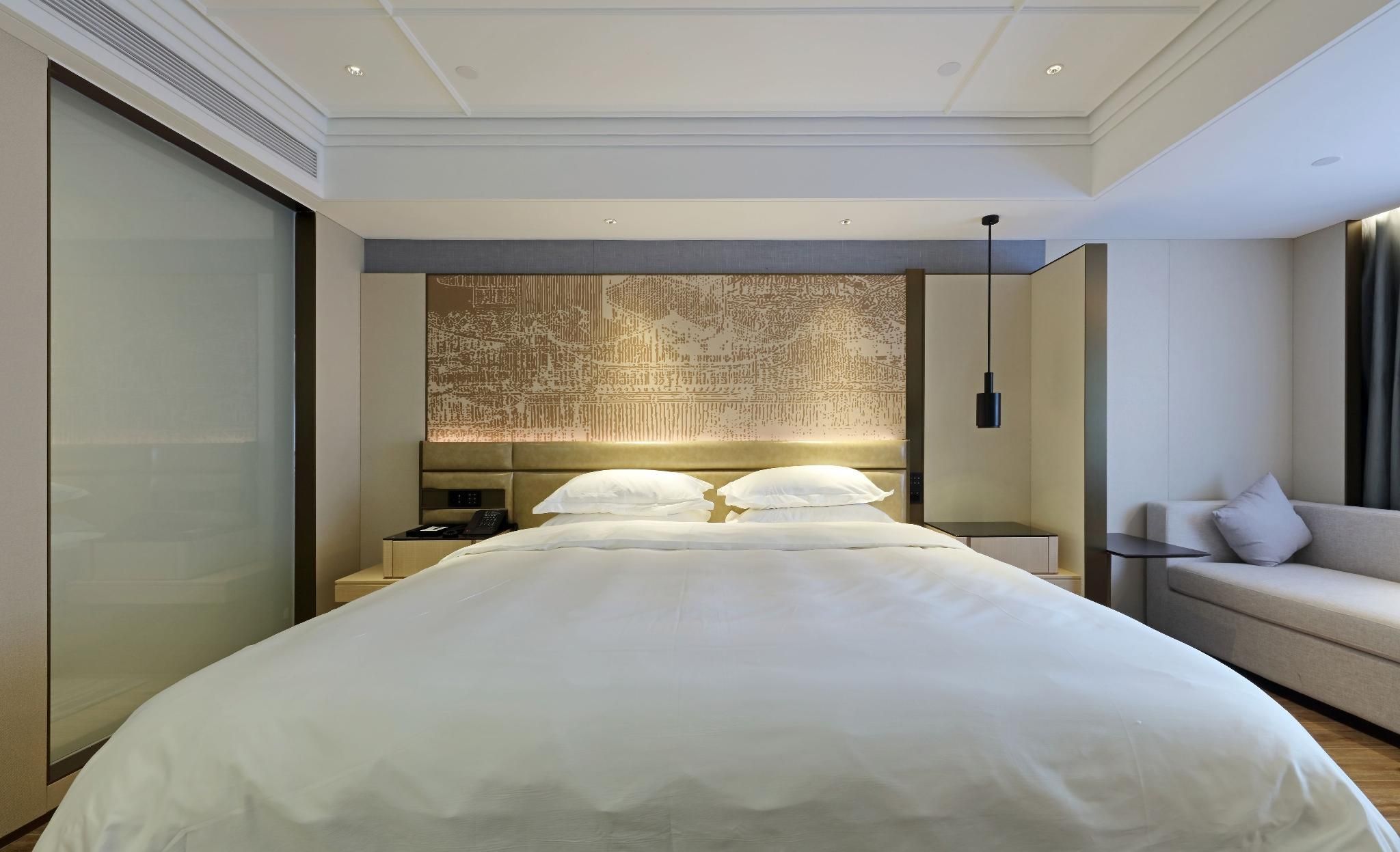 Xingtai Business Hotel - تشيوانتشو - غرفة نوم