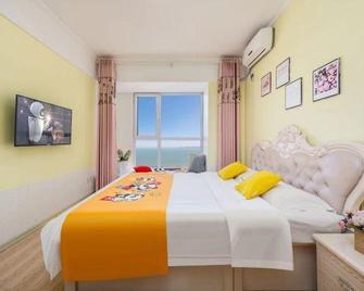 Du Shang Hua Yi Holiday Apartment (Weihai Convention and Exhibition Center, Liu Gongdao Dock Store) - Weihai - Bedroom