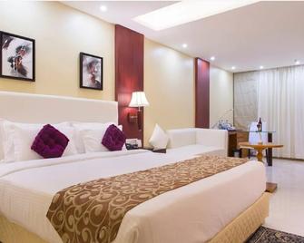 Hotel Trinity Grand - Raigarh - Bedroom