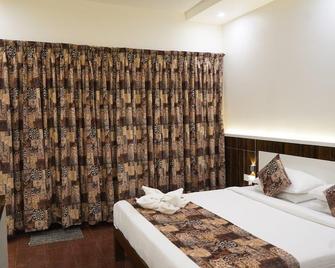 Hotel Pleasant Stay - Bijapur - Camera da letto