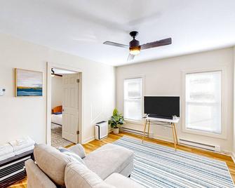 Bright apartment with large covered balcony - steps to town - Glens Falls - Living room