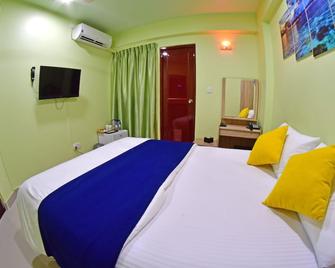Tourist Inn - Pulau Male - Kamar Tidur