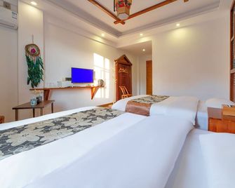 Zhangjiajie Xinghe Qingmeng Folk-style Inn - ג'אנגג'יאיי - חדר שינה