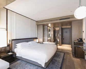 Hawaii International Hotel - Mudanjiang - Schlafzimmer