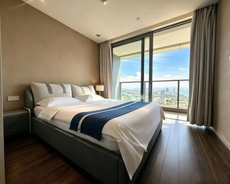 Haiyun Kaixinuo Seaview Holiday Apartment - Sanya - Yatak Odası
