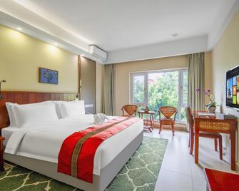 New Tai Garden Holiday Hotel - Xishuangbanna - Habitación