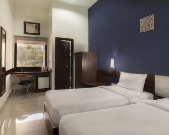 Ginger Guwahati - גוואטי - חדר שינה