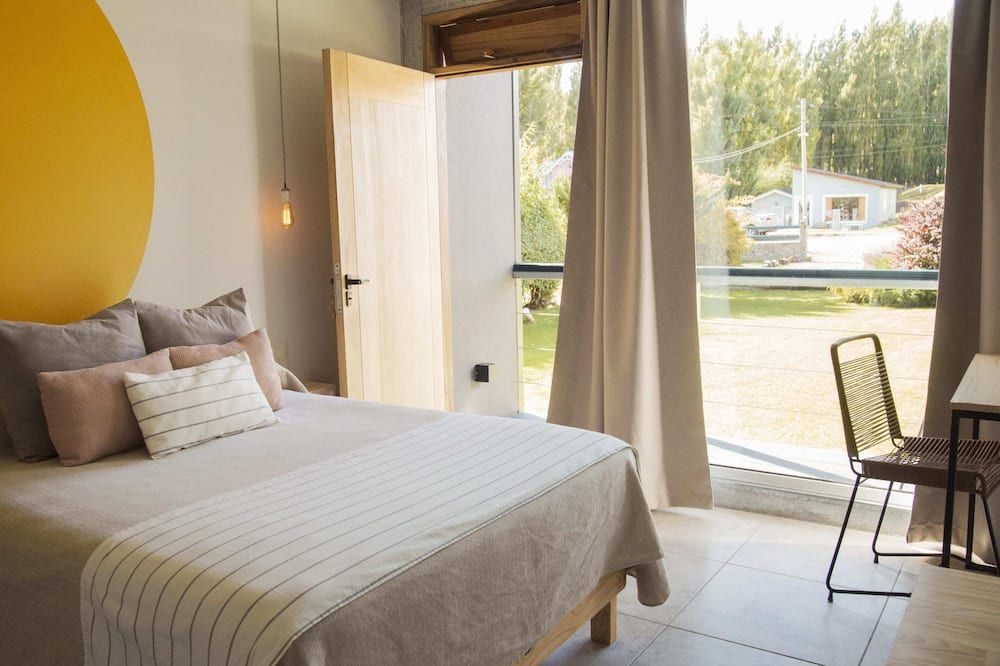 Apart Hotel el Jardin de los Presentes - אל קאלאפטה - חדר שינה