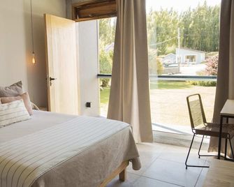 Apart Hotel el Jardin de los Presentes - אל קאלאפטה - חדר שינה