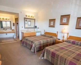 Bullwinkles Rustic Lodge - Poplar Bluff - Schlafzimmer