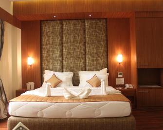 Pristine Residency - อาเมดาบัด - ห้องนอน