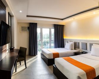 سوتوجراندي إلويلو هوتل - إيلويلو ستي - غرفة نوم