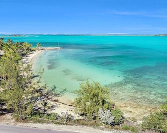 Ixora West - Views over Elizabeth harbor, beach access across the road. - Georgetown - Beach