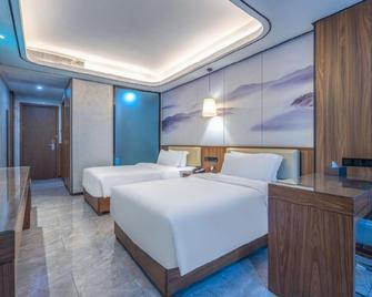 Haikou Wuzhishan International Hotel - Haikou - Kamar Tidur