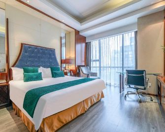 Gomine Apartment Hotel (Ningbo Yinyi Global Center) - Ningbo - Bedroom