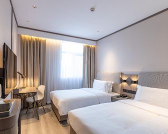 Hanting Hotel Tianjin Yibindao Metro Station - Tianjin - Slaapkamer