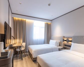 Hanting Hotel Tianjin Yibindao Metro Station - تيانجين - غرفة نوم