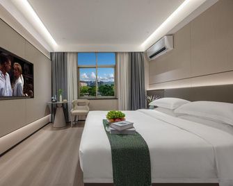 T · Island Smart Cinema Hotel - Taizhou - Slaapkamer