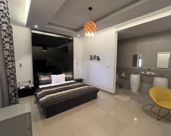 Hotel Riviera Ramatou Plage - Lomé - Ložnice
