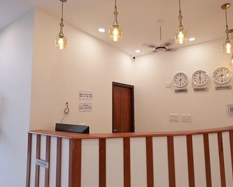 Augma Residency - Taliparamba - Front desk