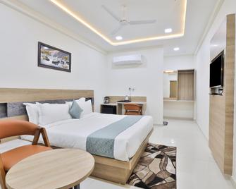 Hotel Sr Inn - Ānand - Bedroom
