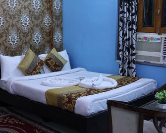 Hotel Anand Lok - ראיגיר - חדר שינה