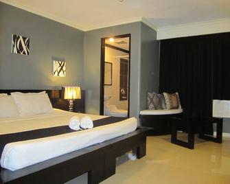 Richmond Plaza Hotel - Cebu City - Schlafzimmer