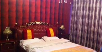 Nissi Holiday Hotel - Kunming - Makuuhuone