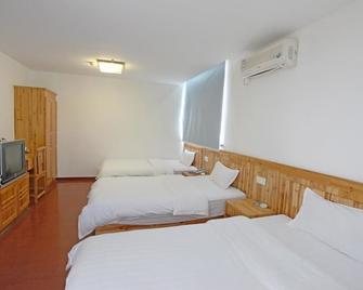 Wanjia Business Hotel - Huangshan - Kamar Tidur