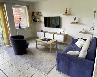 Modern 2-room apartment in the quiet East Village with views of the nature reserve - Baltrum - Huiskamer