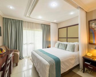 أزامبيزي ريفر لودج - شلالات فيكتوريا - غرفة نوم