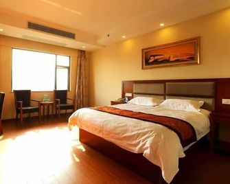 Greentree Inn Jiujiang Railway Station Qianhongxiang Hotel - Jiujiang - Schlafzimmer