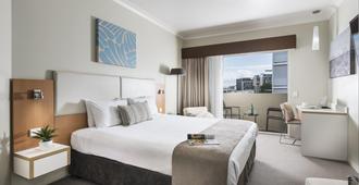 Grand Hotel and Apartments Townsville - Townsville - Yatak Odası