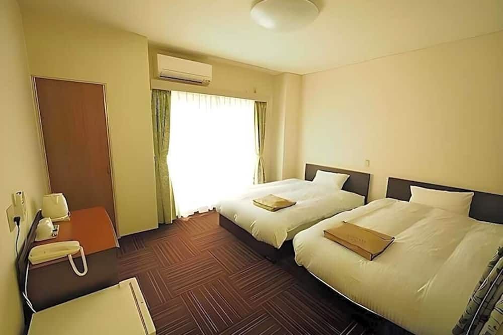 Business Hotel Urbanty Nishikujo - אוסקה - חדר שינה