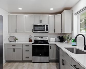 Sleek modern design meets peaceful retreat for a comfortable stay. - Burley - Kitchen