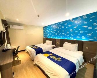 7 Days Inn Guanghan Zhong Yang Xin Cheng Branch - Deyang - Спальня