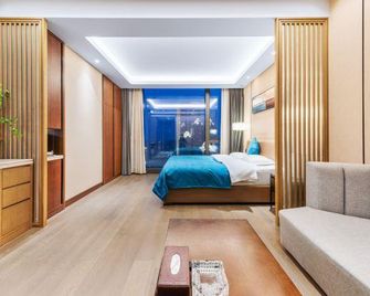 Rezen Esa Apartment Zhengzhou Grand Emporium - Zhengzhou - Camera da letto