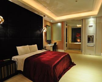 Qixing Jingpin Motel - Lugang Township - Bedroom
