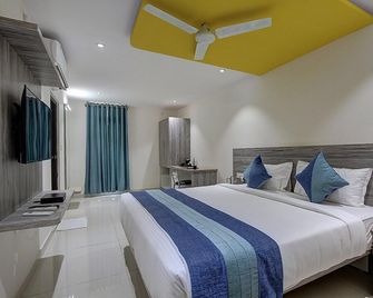 Orange Suites & Inn Bangalore Airport - Bagaluru - Schlafzimmer
