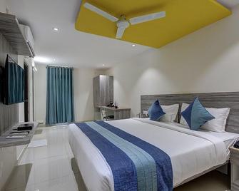 Orange Suites & Inn Bangalore Airport - Bagaluru - חדר שינה